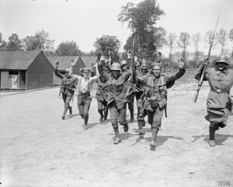 Men of the 36th (Ulster) Division at rest with souvenirs of the capture of Wytschaete. Near Dranouter, June 11, 1917.