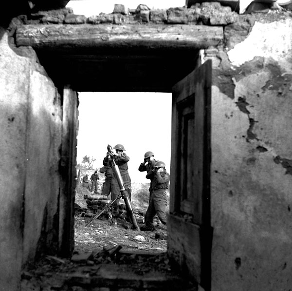 Personnel of the Saskatoon Light Infantry firing a 3-inch mortar, near Ortona, Italy. Photo: BiblioArchives / LibraryArchives CC BY 2.0