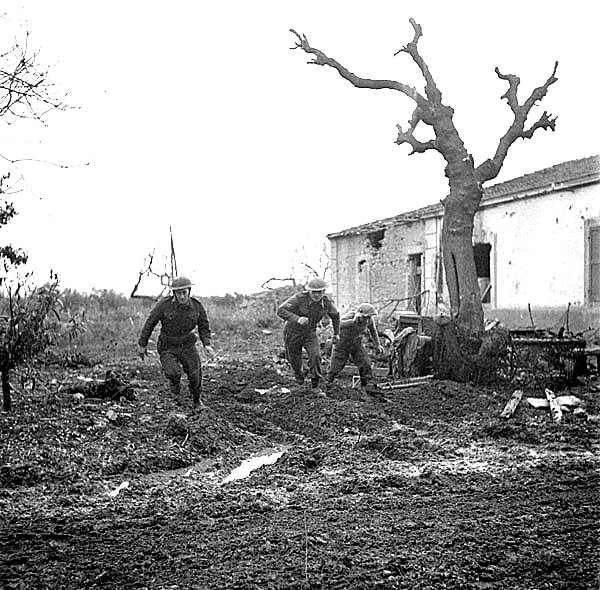 Riflemen of the 48th Highlanders of Canada take cover during a German counterattack north of San Leonardo in the Moro River Campaign.