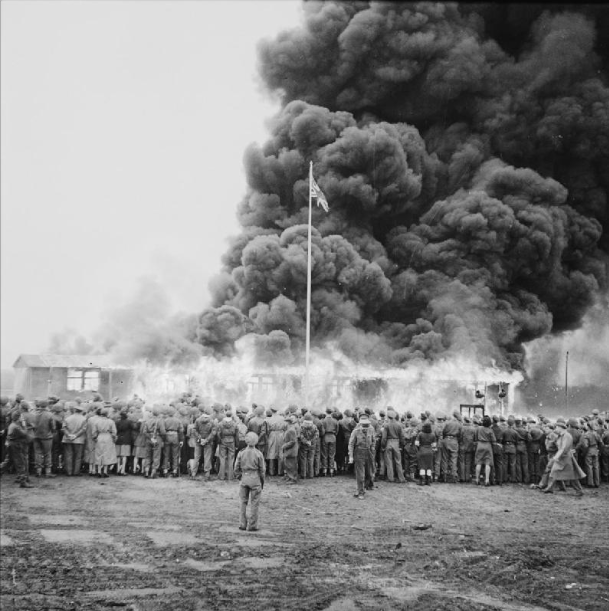 The Liberation of Bergen-belsen Concentration Camp, May 1945.Crowds watch the destruction of the last hut at Belsen two days after the camp was finally evacuated. The hut was set on fire by a British flamethrower.