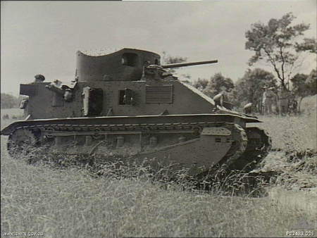 Side view of a Vickers Mark 2 Medium tank on manoeuvres. This tank weighs fifteen tons and is armed with a 47mm main gun and three .303 machine guns.