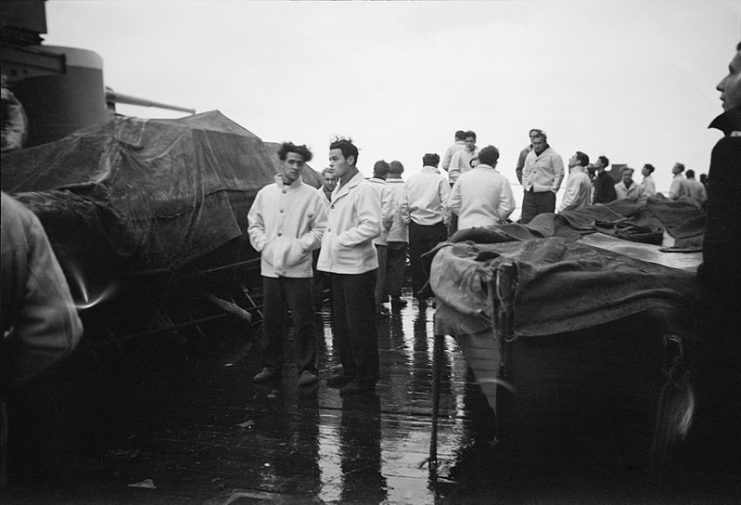 Survivors of the SCHARNHORST under guard on the catapult deck of HMS DUKE OF YORK at Scapa Flow after the sinking of the German warship on 26 December 1943.