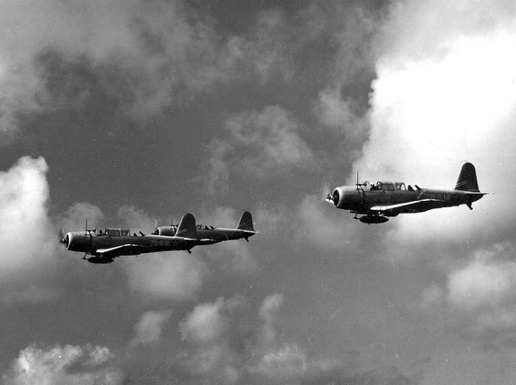 Three U.S. Navy Vought SB2U Vindicators from Scouting Squadron 72 (VS-72) from the USS Wasp (CV-7) in flight over water on 4 December 1941.