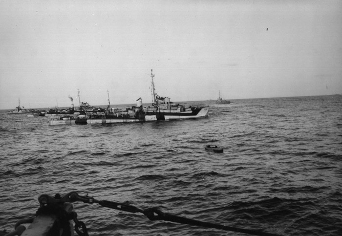 A life raft carrying survivors from U-546 in the midst of a group of U.S. Navy destroyer escorts on April 24, 1945