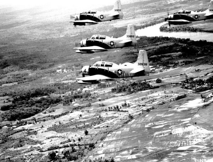 A-1E Skyraiders fly in formation over South Vietnam on way to target on 25 June 1965. The aircraft are assigned to the 34th Tactical Group, based at Bien Hoa Air Base, South Vietnam.