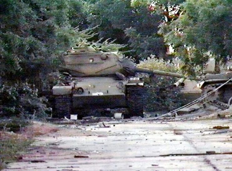 Three knocked-out Somali National Army (SNA) M47 Patton medium tanks left abandoned near a warehouse following the outbreak of the civil war