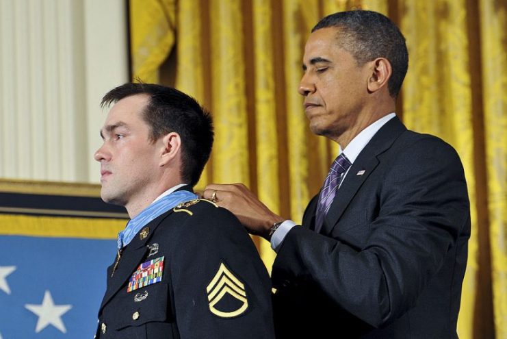 President Barack H. Obama awards the Medal of Honor to former Army Staff Sgt. Clinton L. Romesha during a ceremony at the White House in Washington, D.C., on Feb. 11, 2013.