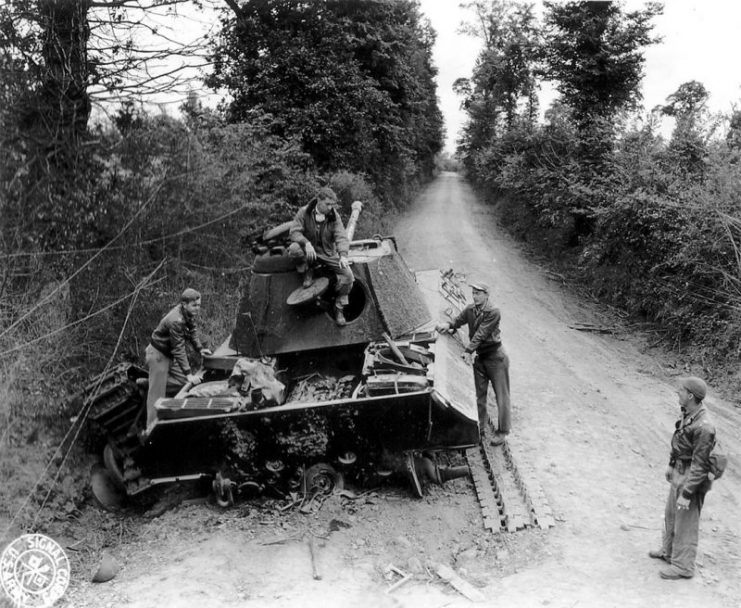Wrecked Panther tank with a destroyed engine, Normandy, 1944.