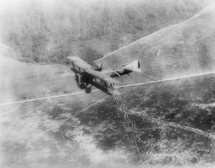 “Chateau Thierre Aeroplane”, a World War I aircraft, in flight over Argone Forest and French trenches