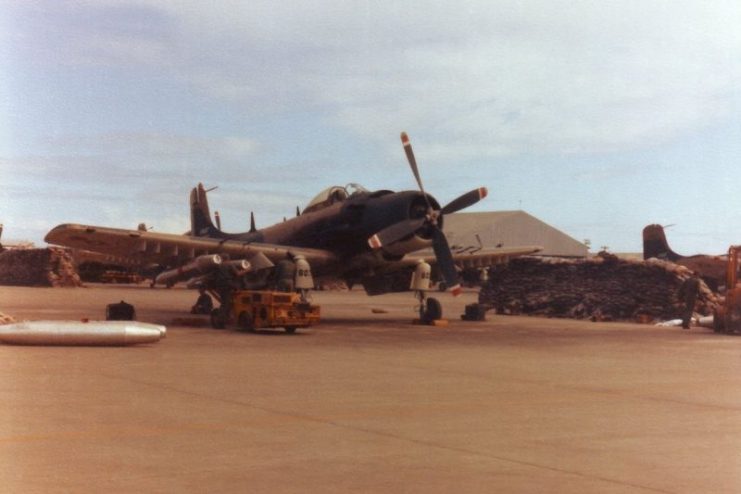 An A-1H Skyraider of the VNAF 516th Fighter Squadron being loaded with napalm at Da Nang Air Base in 1967. Photo by Sciacchitano CC BY SA 3.0