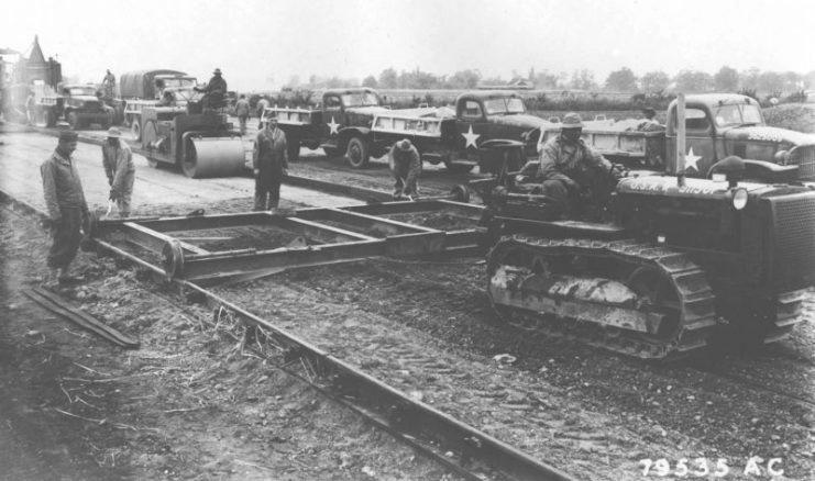Members of an aviation engineer battalion construct a heavy bomber airfield near Eye, England, in 1943. (U.S. Air Force photo)