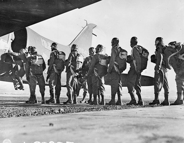 Forcemen of the First Special Service Force boarding a Douglas C-47 aircraft during parachute training at Fort William Henry Harrison, Helena, Montana.