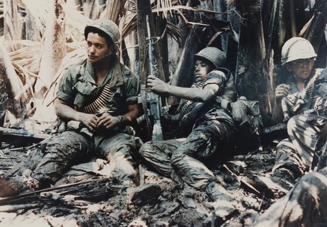 U.S. army troops taking a break while on patrol during the Vietnam War