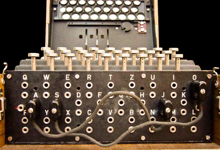 Enigma plugboard (Steckerbrett) was positioned at the front of the machine, below the keys. When in use during World War II, there were ten connections. In this photograph, just two pairs of letters have been swapped (A↔J and S↔O).Photo: Bob Lord CC BY-SA 3.0