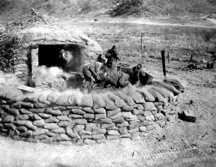Men of the 4.2 mortar crew, 31st Heavy Mortar Co. fire at enemy position, west of Chorwon, Korea.
