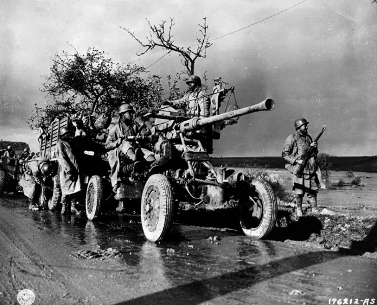 African American artillery troops on march in Belgium.