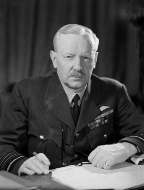 Air Chief Marshal Sir Arthur Harris, Commander in Chief of Royal Air Force Bomber Command, seated at his desk at Bomber Command HQ, High Wycombe.