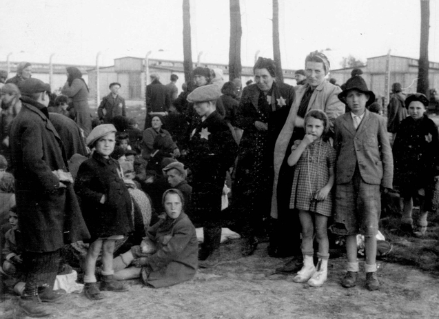Jewish women and children waiting in a grove near gas chamber no. 4 prior to their extermination.