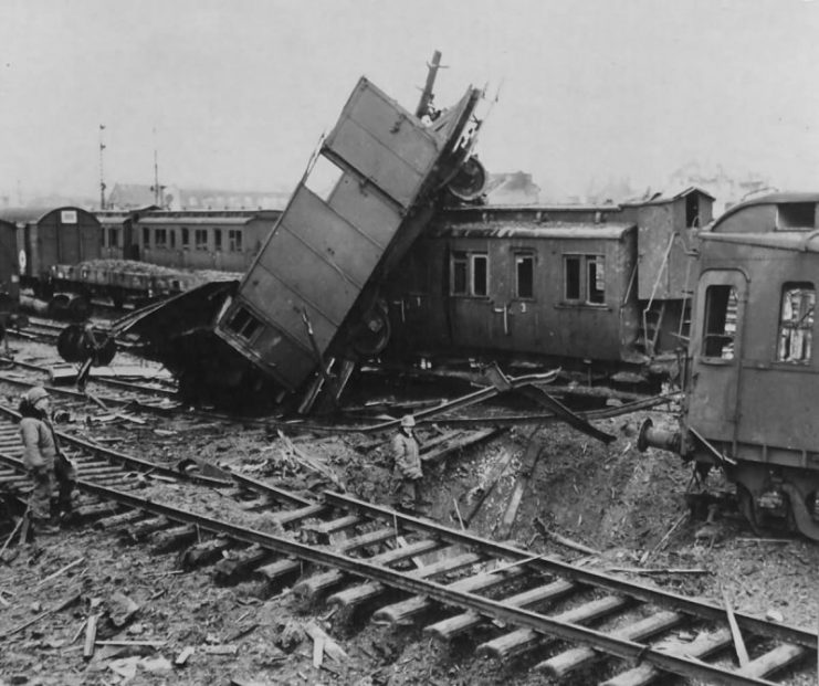 GIs in a heavily bombed railroad yard Near Köln, April 1945