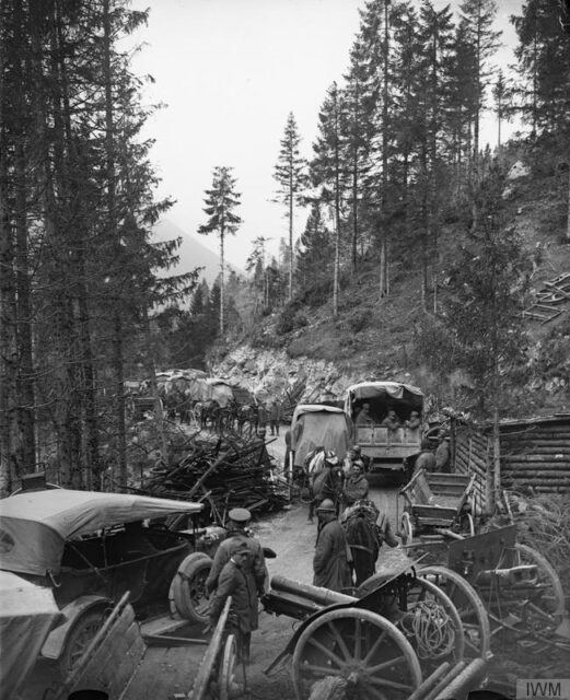 British and Italian troops walking through a mountain pass