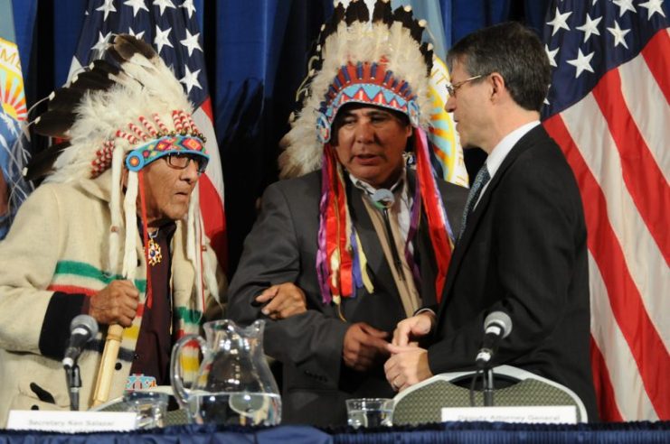 Crow Nation Members Joe Medicine Crow and Leonard Bends with Deputy Attorney General David Ogden, U.S. Department of the Interior CC BY-SA 2.0