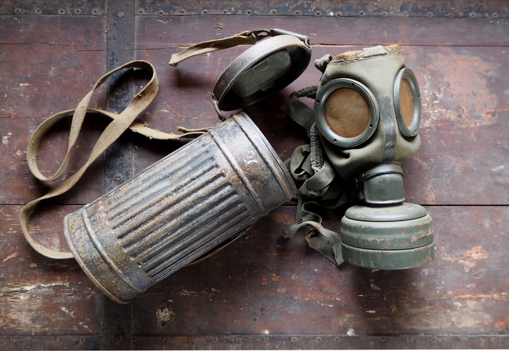 German Army old gas mask with its container, used during second world war .