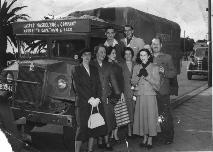 Jasper Maskelyne and his magic troupe departing from Nairobi in 1950. Jasper Maskelyne is on the right, touching the arm of Yvonne Helliwell, his stage assistant.
