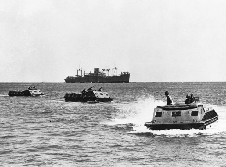 LVT-1 move toward the beach on Guadalcanal. The USS President Hayes (AP-39) is seen in the background.