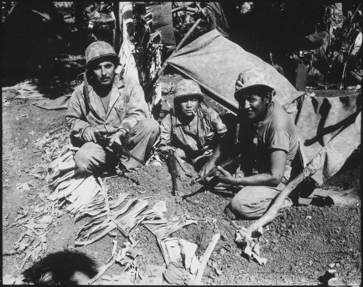 Navajo Indian communication men with the Marines on Saipan who landed with the first assault waves to his the beach.