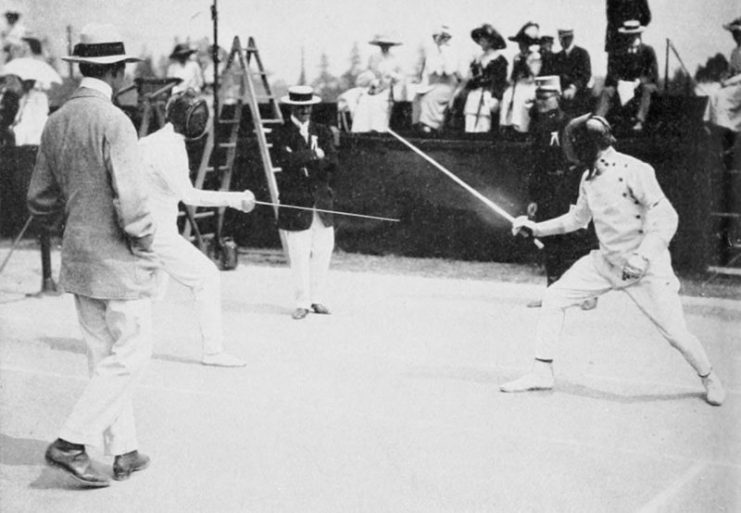 Patton (at right) fencing in the modern pentathlon of the 1912 Summer Olympics