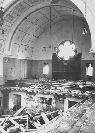 Prayerbooks lie scattered on the floor of the choir loft in the Zerrennerstrasse synagogue in Pforzheim, destroyed on Kristallnach
