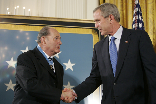 President George W. Bush congratulates Korean War era veteran Corporal Tibor “Ted” Rubin, after awarding Rubin the Medal of Honor, Friday, Sept. 23, 2005 during ceremonies in the East Room of the White House. Rubin was honored for his actions under fire, and his bravery while in captivity at a Chinese POW camp. Photo by Paul Morse, Courtesy George W. Bush Presidential Library & Museum