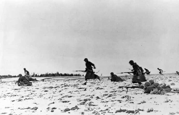 Red Army infantrymen running through a snowy field