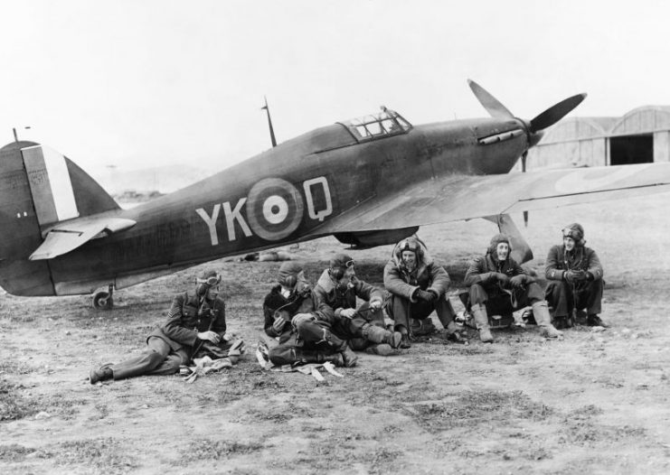 Pilots of No. 80 Squadron RAF relax in front of Hawker Hurricane Mark I, Greece.