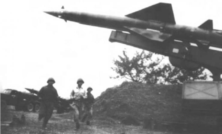 North Vietnamese personnel scramble to ready an SA-2 missile to engage American aircraft.