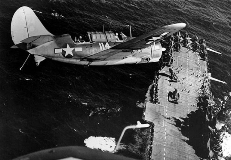 SB2C Helldiver over USS Hornet during World War II. US Naval History & Heritage Command
