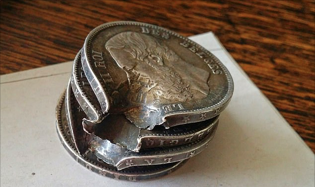 A blessing (and a curse)- Belgian soldier Optatius Buyssens gave away his position to German troops when these coins began making a clinking noise in his pocket – but they also saved his life when their bullet ricocheted off them.Photo by Vincent Buyssens