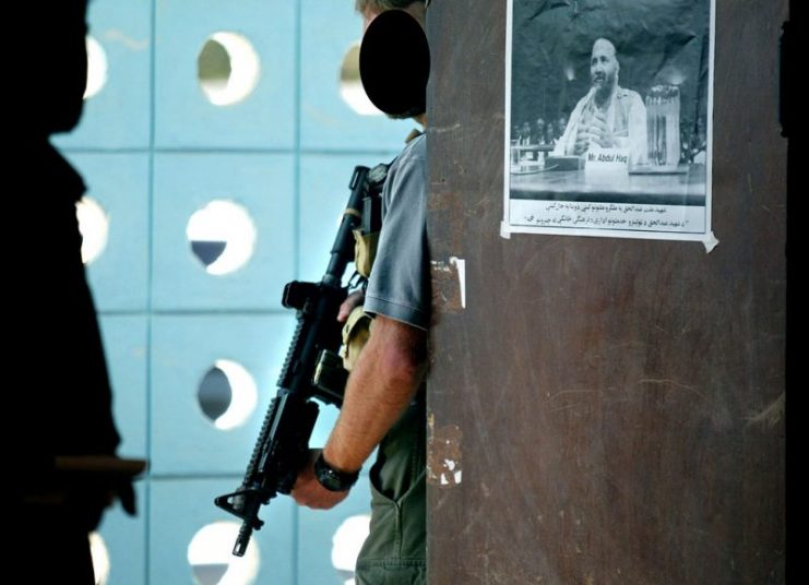 A SEAL Team Six operator stands guard while on Close Protection duty in Afghanistan.