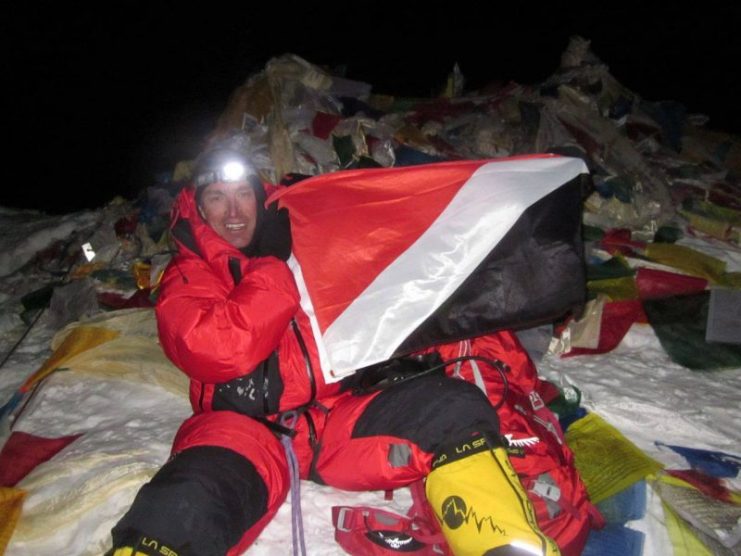 Keton Cool while fixing the flag of the Principality of Sealand on Everest