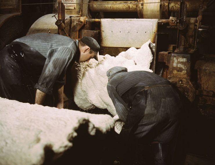 Sheet of synthetic rubber coming off the rolling mill at the plant of Goodrich (1941).