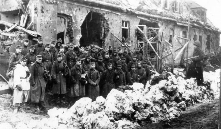 US Army 2nd Infantry Division Guard with German Prisoners near Schoneseiffen 1945 Germany.