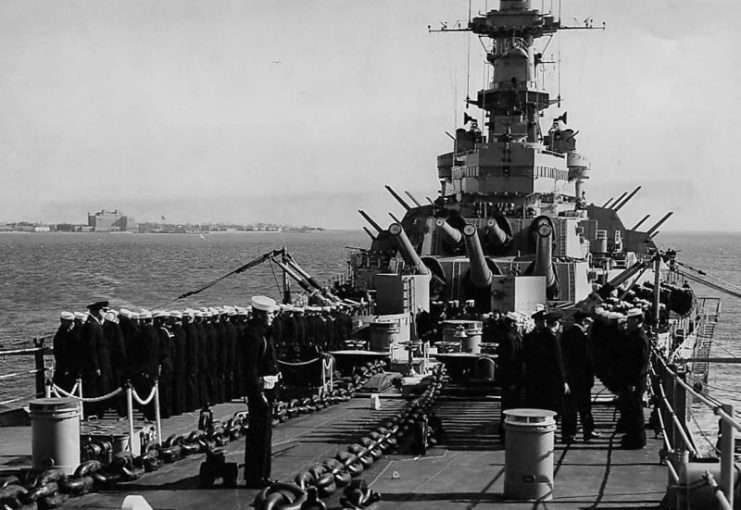 Officers and men stand at attention