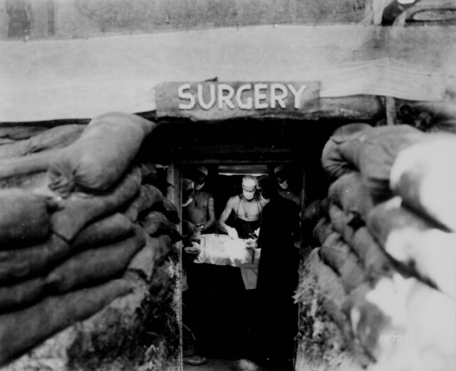 Two more Japanese soldiers entered the tent and were struck down before he noticed four more Japanese crawling under the tent walls.