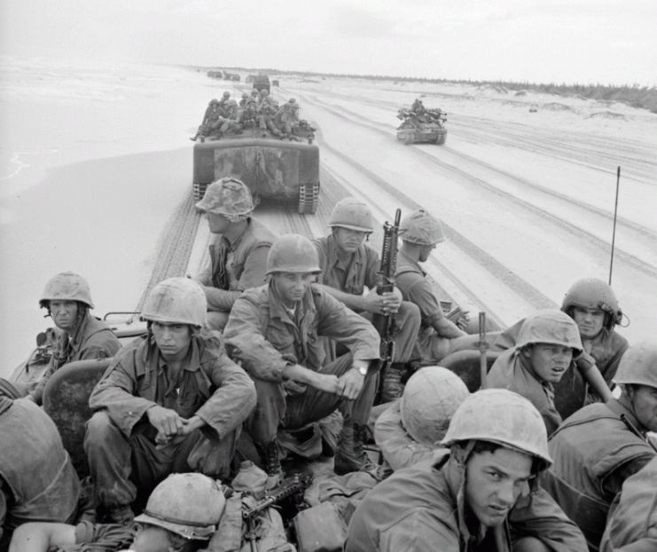 U.S. Marine Corps LVTP-5 amphibious tractors transport 3rd Marine Division troops in Vietnam, 1966.U.S. Marine Corps LVTP-5 amphibious tractors transport 3rd Marine Division troops in Vietnam, 1966.