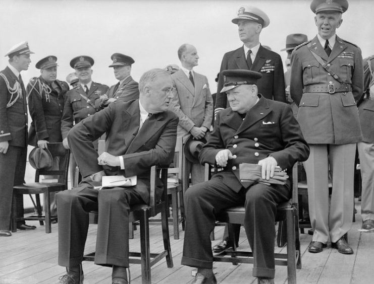 President Roosevelt and Winston Churchill seated on the quarterdeck of HMS Prince of Wales for a Sunday service during the Atlantic Conference, 10 August 1941.