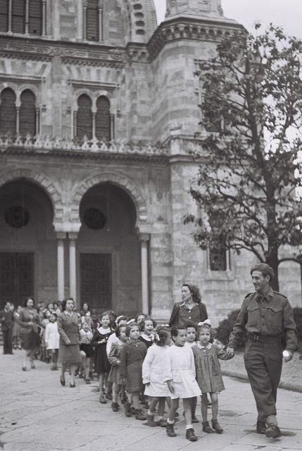 A Jewish Brigade Soldier and Nurses of the Jewish Agency Taking Care of Jewish Refugee Children in Florence, Italy, 1944.