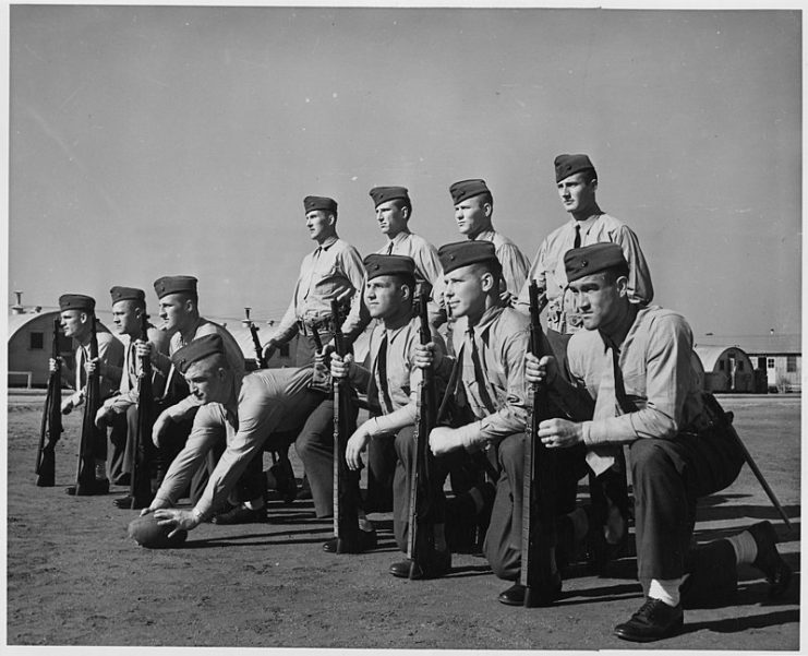 Eleven football players who have gained national recognition on the gridiron are now undergoing Marine Corps training at Parris Island,SC.Backfield Top Left: Angelo Bertelli