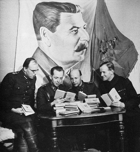 Finnish officers inspecting Soviet skiing manuals gained as loot from the Battle of Suomussalmi