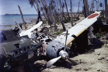 A Japanese Mitsubishi A6M3 Zero (“T2-157”) abandoned at Munda Airfield (Central Solomon Islands), after the Allied Invasion, September 1943.