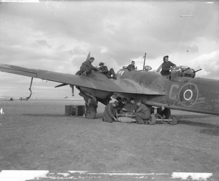 Fitters, armorers, and mechanics of No. 13 Squadron prepare Bristol Blenheim Mark VD ‘C’ for a sortie at Canrobert, Algeria during the Second World War.